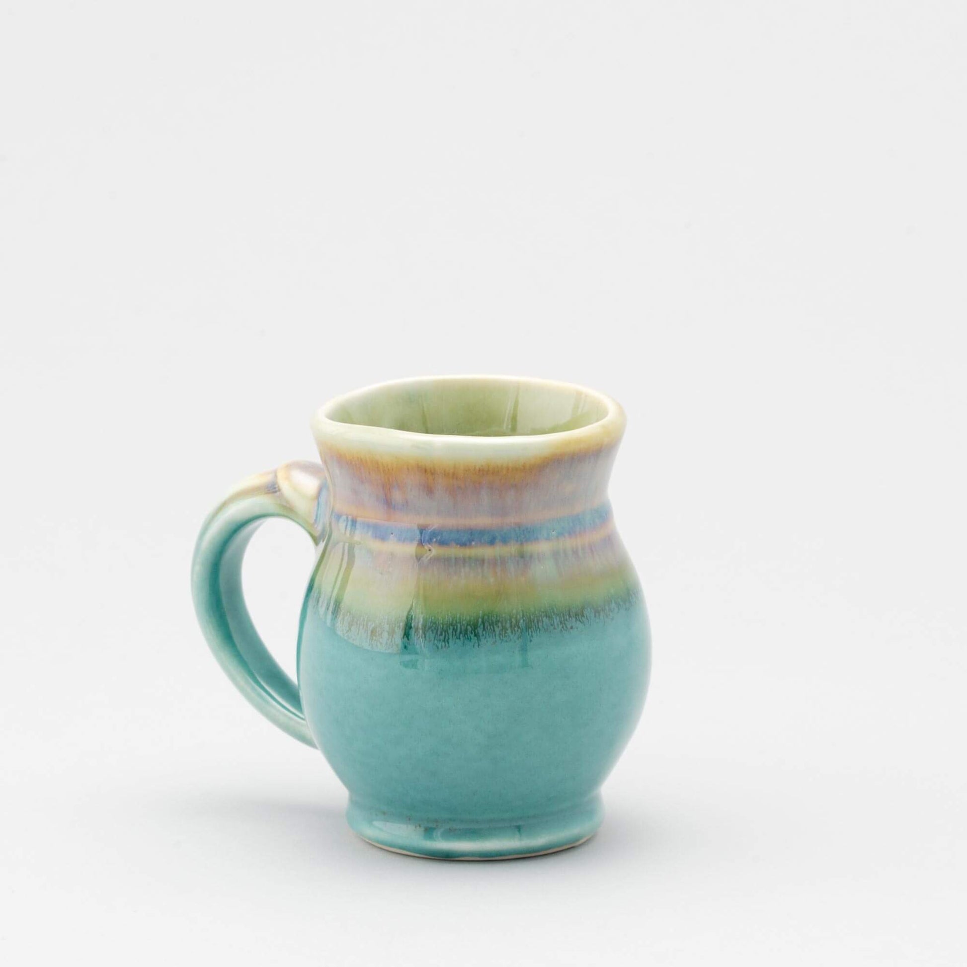 Handmade Pottery Curvy Mug made by Georgetown Pottery in Maine Green Oribe